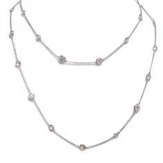 As classic and elegant as it gets. This 35 inch Platinum and Antique Old Euro and Old Mine Diamond Necklace can be a very dressed up piece of jewelry but equally as great worn with a simple white T-Shirt and jeans. The 29 diamonds are all bezel set with open backs and vary in weight from .15 Cts up to .64 Cts each. Total Diamond weight is 8.58 Cts. H-M Color SI-Clarity. Simply dazzling and a phenomenal fine jewelry wardrobe addition. The chain can be doubled or worn singly and the collection of Formal White Single Strand Diamond Necklace, White Sustainable Diamond Necklace For Everyday Luxury, Classic White Diamond Necklace, Classic Platinum Necklace With Rose Cut Diamonds, White Diamond Necklace With Accents For Everyday Luxury, Elegant Long Diamond Necklace, Everyday Luxury White Diamond Cut Necklace, Classic White Jewelry With Single Cut Diamonds, Classic White Diamond Cut Necklace