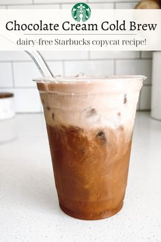 a drink in a cup with a spoon sticking out of it and the words, chocolate cream cold brew dairy - free starbucks copycat recipe