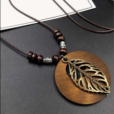 Color: Brown Material: Wood Style: Vacation, Summer, Fashionable Wooden Owl, Womens Chokers, Necklace Dress, Wooden Necklace, Circle Pendant Necklace, Beaded Pendant Necklace, Wood Necklace, Leaf Charms, Leaf Necklace