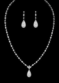 Teardrop CZ Wedding Jewelry SetThis sensational cubic zirconia necklace and matching pierced earring set will be the perfect accessory to complete your elegant wedding day look. This beautiful jewelry set, available in silver or gold plating, features a chain of brilliant round and marquise cut cz crystals with a center decoration of a larger teardrop stone. The matching drop earrings echo this design.Size: Necklace is about 16" long. Pierced Earrings - about 1.5" long.Color: Silver or Gold.Styl Wedding Jewelry Set, Silver Jewellery Indian, Bling Wedding, Silver Jewelry Design, Engagement Rings Opal, Silver Jewellery Sets, Anniversary Jewelry, Jewelry Outfit, Wedding Jewelry Sets