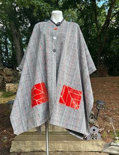 Handmade one of a kind lined poncho Handmade One-size Cape For Fall, Handmade One Size Cape For Fall, Handmade One-size Fall Cape, Handmade Cape Poncho For Fall, One Size Patchwork Outerwear For Fall, Long Sleeve Poncho With Pockets For Fall, Fall Long Sleeve Poncho With Pockets, Red Cape For Fall Outerwear, Red Cape Outerwear For Fall