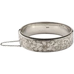 Wonderful sterling silver floral and scroll engraved bangle bracelet with a rope twist edging and a safety chain. It is slightly oval, the inside measurements are 6.4cm / 2.5 inches by 5.5cm / 2.1 inches, and the width is 1.8cm / .7 inch. The bracelet is stamped with a lion, an anchor and the date letter P. This means that the bracelet is sterling silver, was assayed in Birmingham, England, and is dated 1964. The makers mark is JS for Joseph Smith and Sons. The bracelet is in very good condition Engraved Bangle Bracelet, Scroll Engraving, Engraved Bangle, Twisted Bangle, Joseph Smith, Rope Twist, Jewellery Ideas, Safety Chain, 1960s Fashion