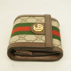 Gucci Bifold Wallet Ophidia 598662 GG Supreme BeigeBrand: GucciGender: WomenLine: OphidiaModel: Bi-fold wallet 598662Colour: BeigeMaterial: GG SupremeSize (HxWxD): 12cm x 11cm x 3cm / 4.72'' x 4.33'' x 1.18'' New Taiwan Dollar, Costa Rican, Gold Ounce, St Helena, North Korean, Colour Beige, Fold Wallet, Bifold Wallet, Gucci