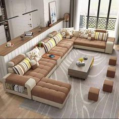 a living room filled with lots of couches and tables in front of large windows