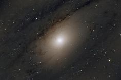 an image of a spiral galaxy with stars in the night sky, taken from space