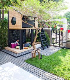 a small house with a tree in the yard