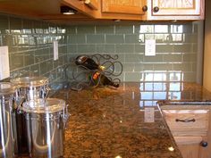 the kitchen counter is clean and ready to be used as a wine rack for bottles