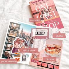 an open book with pictures and words on it next to some other items that are laying on top of a bed