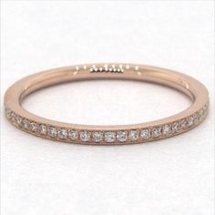 Crafted in 14K rose gold, this single row diamond band with delicate milgrain detail is chic and timeless. Wear this simply beautiful band on its own or stack with other rings for a fashion forward look. James Allen Ring Style: 81128R14 #weddingrings #weddingring #engagementrings #engagementring #marryme #proposal #isaidyes #dreamwedding #propose #showmeyourrings #theknotrings #heputaringonit #imengaged #ido #diamondring #stackablerings #jamesallen #jamesallenrings #eternityband James Allen Rings, Bold Statement Jewelry, Women's Jewelry And Accessories, Ring Style, Diamond Band, James Allen, Eternity Bands, Simply Beautiful, Diamond Bands