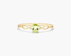 14K Yellow Gold Infinity Peridot Birthstone Ring. The birthstone of August, peridot is known for its distinctive light green color and is said to bring strength, joy, prosperity, and good health to those who wear it. It is also known to bring harmony to romantic relationships and protect against evil, jealousy and even bad dreams. This delicate infinity ring is the perfect piece for your special someone Peridot Birthstone Ring, Peridot Birthstone, Light Green Color, Jewelry Photoshoot, Jewelry Diamonds, Bad Dreams, Infinity Ring, Peridot Ring, Diamond Settings