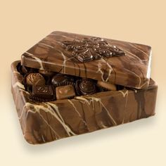 a chocolate box with many pieces of chocolate in it