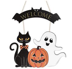 a sign that says welcome with a cat and a ghost sitting next to each other