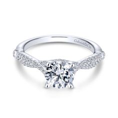 an 18k white gold round diamond engagement ring