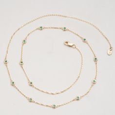 Gwen Timelessly beautiful, glistening Emeralds appear to float on your neck, with refined elegance. You will immediately feel like royalty! The classic station necklace will be your go-to, and truly never goes out of style as it just enhances your natural beauty. Also, it’s such an easy style to layer with other dainty necklaces. May’s birthstone, this stunning necklace will be the perfect gift for a woman of any age! - Handmade- Solid Gold- Natural Emerald- Bezel Size: 3 mm- Space Between the B Dainty Necklaces, Handmade Fine Jewelry, Easy Style, Station Necklace, White Gift Boxes, Stunning Necklace, Rose Gold Necklace, Natural Emerald, Gold Set