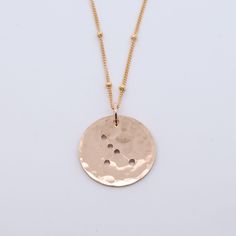 What's your sign? These sweet handmade zodiac necklaces are written in the stars, literally. Strung on a 18 inch chain in the metal of your choice, this coin has tiny dot zodiac star cut outs. Simply select your sign and we'll send you the stars. Need one for a friend? Take a peek at all twelve! 3/4”L Coin on a 18” Chain. Dainty Zodiac Sign Round Necklace, Dainty Zodiac Sign Necklace, Rose Gold Zodiac Sign Round Pendant Necklace, Rose Gold Zodiac Sign Jewelry For Gift, Rose Gold Zodiac Round Pendant Necklace, Celestial Satellite Chain Jewelry As Gift, Celestial Jewelry With Satellite Chain As A Gift, Celestial Jewelry With Satellite Chain For Gifts, Celestial Style Jewelry With Satellite Chain As Gift