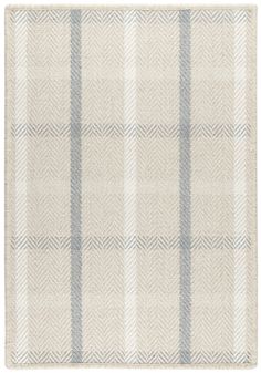 a white rug with blue and grey plaid pattern