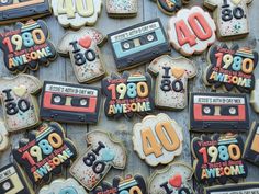 decorated cookies with the words 80th birthday written on them and an old school cassette