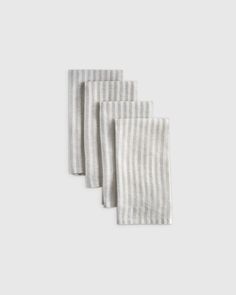 four napkins in grey and white stripes