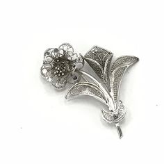 Vintage silver tone flower brooch. Silver Flower Shaped Lapel Pin Brooch, Silver Flower Lapel Pin, Silver Flower Brooch With Floral Decoration, Silver Flower Brooch With Flower Decoration, Silver Flower Shaped Brooch With Floral Decoration, Silver Flower Brooches With Flower Decoration, Silver Flower Lapel Pin Gift, Silver Flower Lapel Pin For Gift, Vintage Sterling Silver Flower Brooches