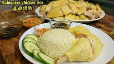 a plate with rice, cucumbers and sauces on it sitting on a table