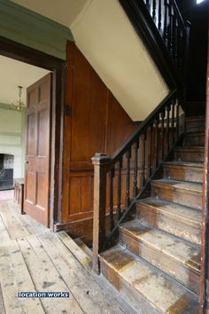 an old wooden staircase leading to the second floor