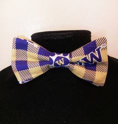 "This pre-tied and self-tie adjustable size bow tie is a perfect accent for any collared shirt! This bow tie can fit a child as young as three years old up to an adult with an 18\" neck size, even a dog or cat! *Finished print layout may vary from featured photo. **This is not a licensed product. Please note for UW, WSU, and Oregon bow ties- fabric prints have been updated as of May, 2020 The bow ties will be made with the new logo print fabrics featured in the photo next to the finished bow tie Adjustable Dapper Ties With Bow Tie Back, Adjustable Butterfly Knot Bow Tie For Black Tie Events, Adjustable Pre-tied Bow Tie, Adjustable Black Tie With Butterfly Knot, Adjustable Black Tie Bow With Ties, Adjustable Bow Tie For Dapper Style, Pre-tied Bow Tie, Adjustable Bow Tie For Suit As Gift, Fitted Bow Tie As A Gift