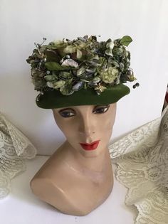 "Vintage 1950's 1960's hat. There are Purple Velvety flower buds and some of the leaves have shades of Purple and Green. The little beads appear to be berries. The label is *Suzy Michelle Original*. *MORE INFORMATION BELOW* CONDITION: No issues noted. MEASURES: Inside circumference~22\" Height~3\" Front to back~8\" Left to right~8\" *WE APOLOGIZE~BUT WE NO LONGER SHIP TO GERMANY, ITALY OR SPAIN. IF ORDERS COME IN FROM GERMANY, ITALY OR SPAIN, WE WILL HAVE TO CANCEL THEM AND REFUND YOUR MONEY. SO 1960s Hats, Large Brim Hat, Types Of Hats, Purple And Green, Flower Bud, Purple Flower, Shades Of Purple, Vintage 1950s, Purple Flowers