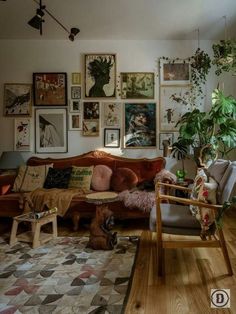 a living room filled with furniture and pictures on the wall