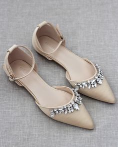 "Embellished pointy toe flats with sparkly row of teardrop rhinestones across toe and detachable ankle strap. Comfort with simplicity perfect for brides and bridesmaids. YOU CAN CHOOSE STYLE OF ANKLE STRAP AT CHECKOUT Details: Colors available: Black, Blush, Burgundy, Champagne, Light Blue, Navy, Red, Royal Blue, Ivory, and White UPPER: Synthetic upper and lining MATERIALS: Mandmade outsole STYLE NAME: BELLA SIZE FIT: RUNS LARGE, ORDER HALF SIZE DOWN FROM YOUR NORMAL SIZE Not sure of which size Flat Wedding Shoes With Rhinestones, Embellished Almond Toe Party Flats, Wedding Flats With Rhinestones And Flat Heel, Wedding Flats With Rhinestones, Embellished Pointed Toe Flats, Embellished Flat Heel Wedding Shoes, Champagne Wedding Shoes, Fall Wedding Shoes, Champagne Shoes