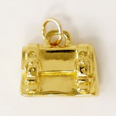 DESCRIPTION The casual and classy version of a briefcase. Our sterling silver satchel charm celebrates your busy day at a job you love. Makes a fantastic gift to show appreciation for the professional in your life! Original design by Pat Frey 1/2 inch length. Type: Three Dimensional. Item Number: 1507 Gold Rectangular Case Bag For Everyday, Luxury Rectangular Briefcase As Gift, Elegant Everyday Jewelry With Charms, Small Elegant Travel Bag, Classic Engraved Jewelry For Everyday, Luxury Rectangular Briefcase For Gift, Gold Rectangular Briefcase For Travel, Gold Rectangular Travel Briefcase, Classic Rectangular Gift Bag