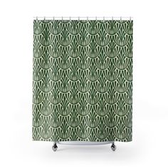 a green shower curtain with an art deco design