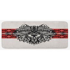 a white bath mat with red and black designs on the front, along with an orange stripe