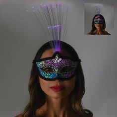 Top off your regal ensemble with this lavender masquerade mask. It features scrolling glitter details purple gem embellishments and feathers on one side that light up with the press of a button. Fiber optic light up mask that has an illuminating rainbow color effect when you take a photo of it with the flash on. The fiber optics on top of center of the mask light up. Velcro closure on elastic band that goes around the head. Adult Reflective Light-Up Masquerade Mask product details:  4in wide x 4 Halloween Costume Mask, Fibre Optics, Halloween Store, Purple Gems, Costume Mask, Party Stores, Masquerade Mask, Fiber Optic, Halloween Masks