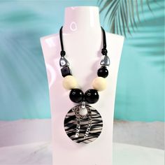 "Zebra-Stripe Big Bold Chunky Necklace-Black  and White Statement Necklace-Adjustable Bead Necklace-Geometric Jewellery-Gift for Her Be Bold with this Zebra-Stripe bold chunky acrylic necklace! This statement necklace is made of high quality acrylic and resin bead . Unique design make this necklace a stunning jewellery piece. This statement necklace is stylish and fun but lightweight and comfortable to wear. A fabulous way to grab everyone's attention! Coming with three colors : Blue ; Orange  or Black & White  Perfect gift idea for  her ! ------------------------------------------- N E C K L A C E ● D E T A I L S ------------------------------------------- ▶Material: Acrylic, resin , Metal ▶Adjustable Length  ▶Necklace Style:  Statement  ▶Color : Black & White  ▶Closure: Lobster Claw ---- Elegant Black Necklace For The Beach, Elegant Black Necklace For Beach, Trendy Adjustable Necklaces, Black Necklaces With Large Beads For Beach, Adjustable Black Beaded Necklaces As Fashion Accessory, Adjustable Black Beaded Necklace As Fashion Accessory, Adjustable Black Choker With Large Beads, Trendy Adjustable Necklace, Trendy Adjustable Necklace As Fashion Accessory