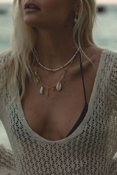 Add a touch of elegance to your outfit with our Golden Hour Pearl Necklace. Featuring a strand of oval organic freshwater pearls mixed with small gold beads, this necklace exudes timeless beauty. Elevate your style and glow in the golden hour. Length: 14-17” (includes a 3 inch extender). Crafted with 14K Gold Filled Chain and freshwater pearls. Handmade with love from San Clemente, CA. Bohemian Gold Beaded Necklace With Pearl Drop, Gold Pearl Necklace With Pearl Charm For Beach, Bohemian Gold Baroque Pearl Necklace, Gold Pearl Necklace For Beach, Gold Pearl Necklace For The Beach, Gold Baroque Pearl Jewelry For Beach, Bohemian Gold Shell Necklace With Pearl Pendant, Gold Baroque Pearl Jewelry For The Beach, Gold Bohemian Pearl Necklace