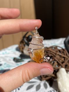 This honey calcite point pendant is wrapped with flat silver wire and features a swirly design.  Honey Calcite features metaphysical properties such as: encouraging feelings of self worth, confidence and courage, assists to overcome obstacles, and removes blockages from the heart and mind. Spiritual Wire Wrapped Crystal Pendant, Wire Wrapped Spiritual Crystals For Healing, Wire Wrapped Citrine Jewelry For Healing, Citrine Wire Wrapped Jewelry For Healing, Spiritual Citrine Pendant Crystal Necklace, Hand Wrapped Spiritual Crystal Pendants, Spiritual Hand Wrapped Crystal Pendant, Spiritual Hand Wrapped Pendant Crystals, Spiritual Hand-wrapped Pendant Crystals