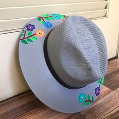 Stay stylish in this beautiful colorful hand painted straw hat, ideal for any sunny day occasion. Every single hat is hand painted uniquely which means there will never be another one like it. MADE IN MEXICO By: Mexican Artisans For: Women Size: Medium (23") Color: gray | multi Details: Material: Palm Straw Leather Band Inner elastic band Contact us for more details PLEASE READ BEFORE PURCHASE: Each product is handmade from Mexico causing differentiation and minor imperfections in each piece mak Spring Festival Sun Hat Hand Painted, Spring Festival Hand Painted Sun Hat, Hand Painted Sun Hat With Curved Brim For Spring, Hand Painted Curved Brim Sun Hat For Spring, Artisan Handmade Sun Hat For Spring, Handmade Artisan Sun Hat For Spring, Adjustable Flat Brim Hand Painted Sun Hat, Adjustable Flat Brim Sun Hat Hand Painted, Adjustable Hand Painted Sun Hat With Flat Brim