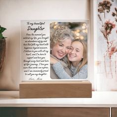 an image of two women with their arms around each other and the words to my daughter on it