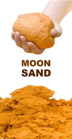 a person holding a cookie in their hand with the words moon sand above them and below it