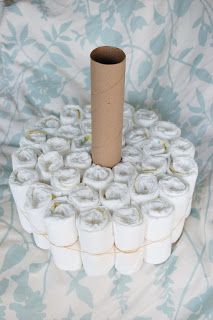 several rolls of toilet paper are stacked on top of each other in the shape of a tower