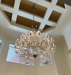 a chandelier hanging from the ceiling in a room