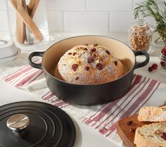 a loaf of cranberry bread in a pan on a kitchen counter