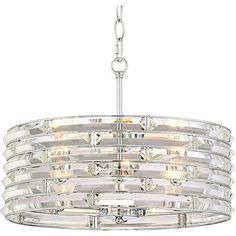 a chandelier hanging from the ceiling with clear glass and chrome rings on it