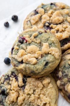 three blueberry crumb cookies sitting on top of each other