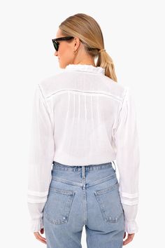 Inspired by a love of surf culture, brothers Alex and Mike Faherty founded a brand of sustainable, high-quality apparel for life's many adventures.Embrace casual bohemian vibes in this peasant style blouse. Featuring romantic blouson sleeves and delicate embroidery along on the neckline and chest, this relaxed and graceful top exudes laid back femininity.

Ladder Trim
Picot Ruffle Sleeves & Neck
Clip Dot Cuffs
Pearl Buttons
100% Cotton
Care: Machine wash cold, lay flat to dry Spring Daywear Peasant Top With Relaxed Fit, Spring Blouse With Smocked Cuffs And Relaxed Fit, Casual Peasant Top With Lantern Sleeves For Daywear, Spring Blouse With Blouson Sleeves And Relaxed Fit, Casual Blouse With Smocked Cuffs And Lantern Sleeves, Casual Lantern Sleeve Blouse With Relaxed Fit, Casual Long Sleeve Top With Smocked Cuffs, White Long Sleeve Peasant Top With Smocked Cuffs, White Peasant Top With Smocked Cuffs And Long Sleeves