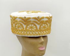 Original handmade beaded caps available in various colors. It can be worn for any occasion. Kindly indicate your head size in inches and your desired color when checking out. Ready to ship in 14business days. Embroidered Gold Cap Hat, Gold Embroidered Cap Hat, Gold Embroidered Cap, Traditional High Crown Costume Hat For Wedding, Traditional White Ceremonial Hat, Traditional White Ceremonial Headpiece, Traditional Handmade Gold Hat, Ceremonial White Handmade Headpieces, Ceremonial Handmade White Headpiece