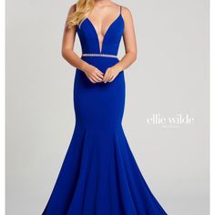 New With Tags Ellie Wilde Mon Cheri Sleeveless Stretch Crepe Trumpet Gown With A Plunging V-Neck,Sheer Side Insets, Scoop Back, Rhinestone Belt At The Natural Waist,Horsehair Hem And A Sweep Train. Royal Blue Size 00 Blue V-neck Dress For Prom, Elegant Blue V-neck Wedding Dress, Blue V-neck Evening Dress For Prom, Elegant Blue Sleeveless V-neck Dress, Blue V-neck Evening Dress For Prom Season, Fitted Blue V-neck Prom Dress, Blue Fitted V-neck Dress For Prom, Blue V-neck Gown For Prom Season, Blue V-neck Prom Gown