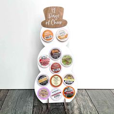 a white plate topped with lots of different types of food on top of a wooden table