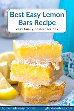 Three lemon bars stacked on a white ceramic plate with lemon wedges on the side. Best Ever Lemon Bars Recipe, Sunny Anderson Lemon Bars, Quick And Easy Lemon Bars, Lemon Bars With Pretzel Crust, How To Make Lemon Bars, Lemon Bars 8x8 Pan, Easy Pan Of Bars, Super Easy Lemon Bars, Lemon Refrigerator Bites