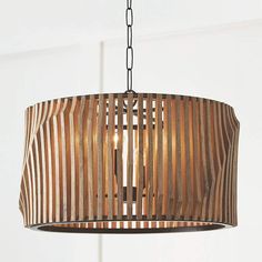 a wooden light fixture hanging from a ceiling